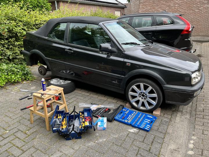 Working on the rear brakes. There are jack stands under the car. (it's not resting on the wheel, thanks for asking)